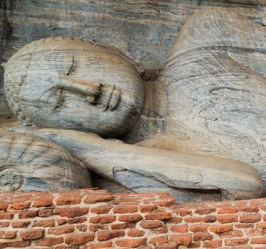 Statue at Gal Vihara of Polonnaruwa remains as the royal ancient city of the capital city by Kingdom of Polonnaruwa of Ceylon, Sri Lanka. World Heritage Convention, UNESCO
