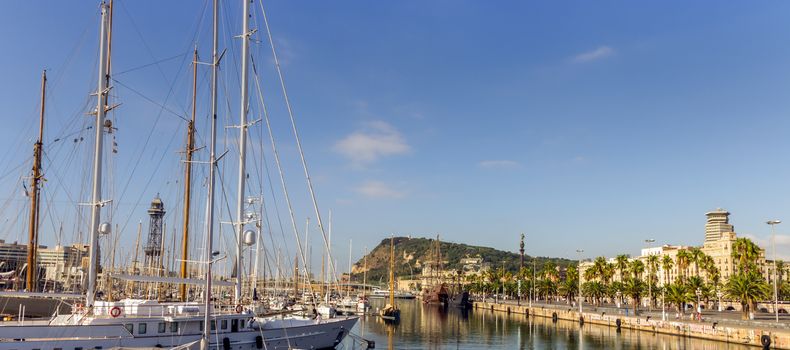 Port Vell old harbor of Barcelona with an area of sports boats, dock and a shopping area. Catalonia, Spain.