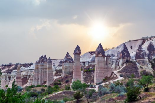 Rising Sun Rock volcanic formations Stone columns, mountain Love valley landscape, Turkey, Cappadocia. Goreme national park.