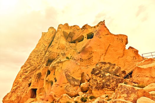 Cave towns in rock formation, Stone houses in Goreme, mountain landscape carved in volcanic tuff Cappadocia, Turkey