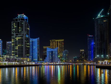Dubai Marina night skyline Cityscape, luxury new high tech town in United Arab Emirates architecture