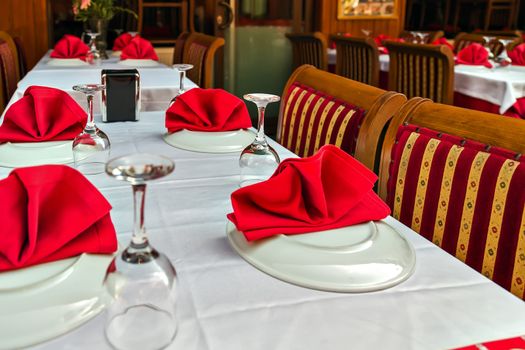 Glasses and plates on reserviert table in restaurant