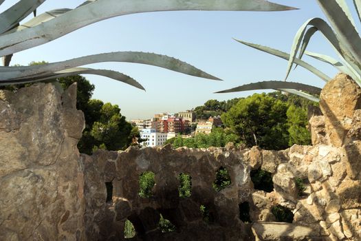 BARCELONA, SPAIN - AUGUST 24, 2012. Catalunya, The entrance of Park Guell with the famous mosaics of Antonio Gaudi located on Carmel Hill, Barcelona, Catalonia,Spain.