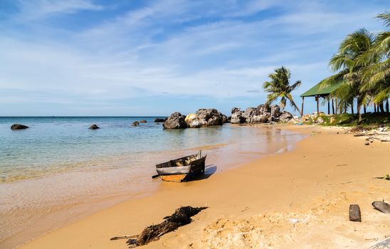 Old wooden shipwreck by the coast of the island, granite rocky beaches on tropical sea. landscape summertime seychelles