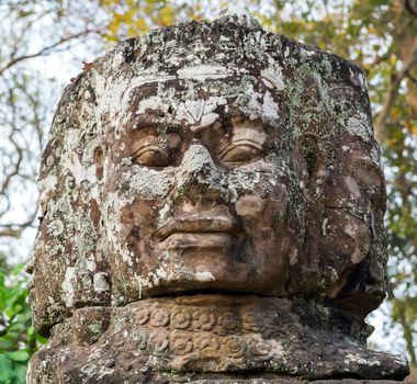 Head stone, Ruins of Angkor Wat, part of Khmer temple complex, Asia. Siem Reap, Cambodia. Ancient Khmer architecture in jungle.