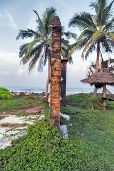 ruined wall of an house in ruins over sea background, hot tropical sunset sky over sea Hurricane