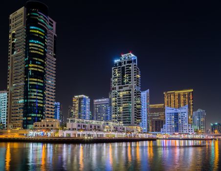 Dubai Marina night skyline Cityscape, luxury new high tech town in United Arab Emirates architecture