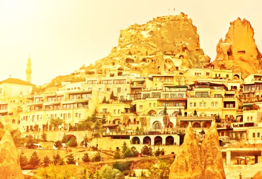 Uchisar castle, Turkey. Rural Cappadocia Mountain landscape panoramic view. Stone houses, Aerial photography.