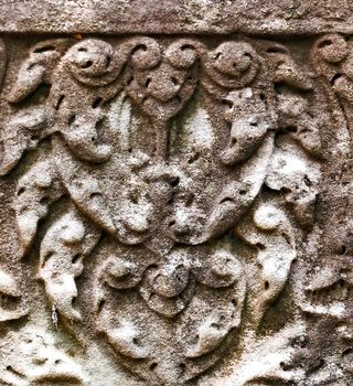 art of ancient Hindu god stone background, detail of the architecture in Bantey Srei temple in the Angkor area, Cambodia.