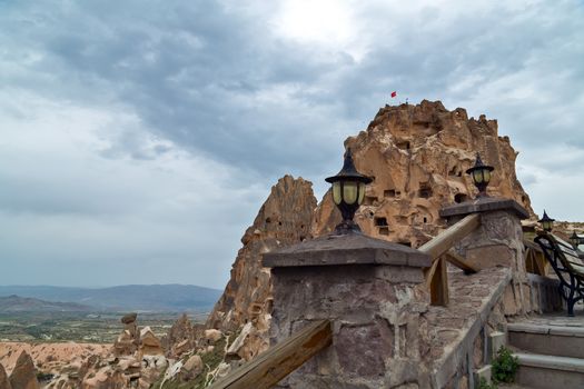 Uchisar castle, Turkey. Rural Cappadocia Mountain landscape panoramic view. Stone houses