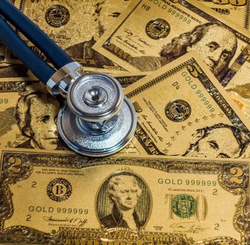 Stethoscopes US currency cash note bill design american dollars banknotes money gold fake background Finance business concept