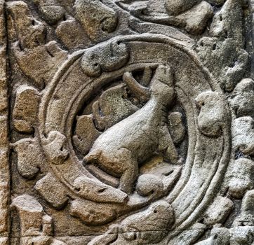 art of ancient Hindu god stone background, detail of the architecture in Bantey Srei temple in the Angkor area, Cambodia.