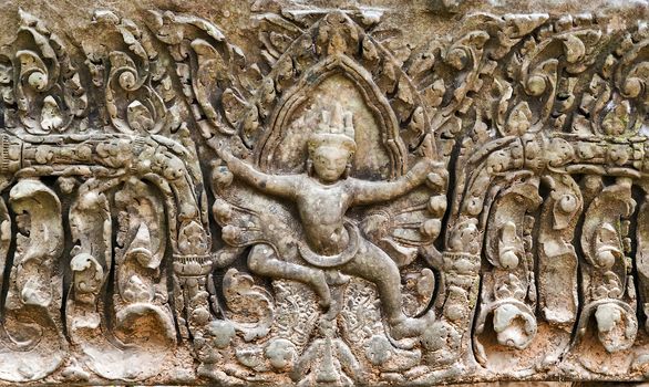 art of ancient Hindu god stone background, detail of the architecture in Bantey Srei temple in the Angkor area, Cambodia.