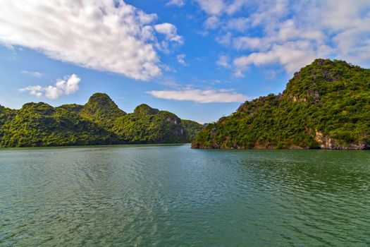 Boat cruise Junks and Floating village in Halong Bay, Vietnam.UNESCO World Heritage Site.