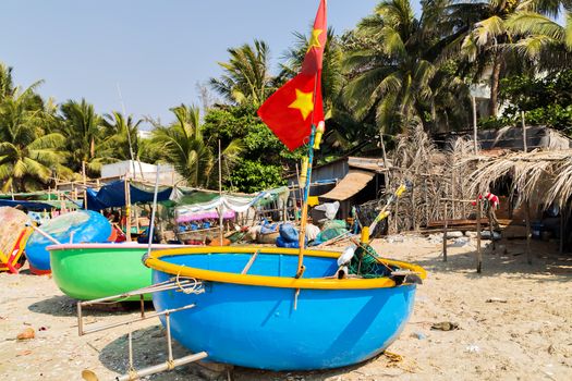 Vietnamese fishing old basket boat with flag Vietnam