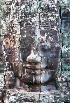 Stone smiling face King Jayavarman VII towersin Prasat Bayon, Khmer temple constructed in the late 12th or early 13th century and located in the ancient city of Angkor, today Cambodia.