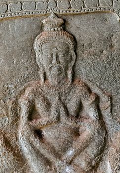 art of ancient Hindu god stone background, detail of the architecture in Bantey Srei temple in the Angkor area, Cambodia.