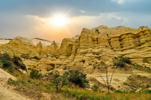 sunrise in the Love valley limestone sandstone of Cappadocia, Rocky mountain Landscape wall of stone striped, Turkey