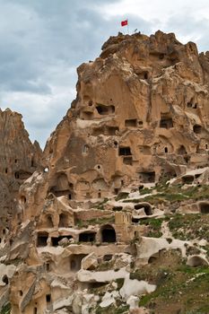 Uchisar castle, Turkey. Rural Cappadocia Mountain landscape panoramic view. Stone houses