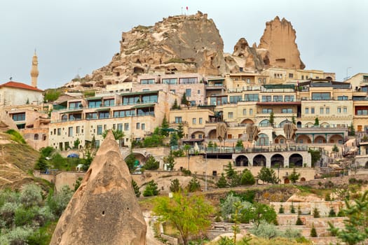 Turkish fortress Uchisar, Turkey. Rural Cappadocia Mountain landscape panoramic view. Stone houses