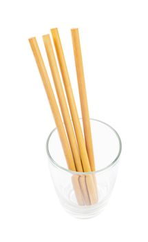 Ecological bamboo straws tube in glass isolated on white background, Save clipping path.