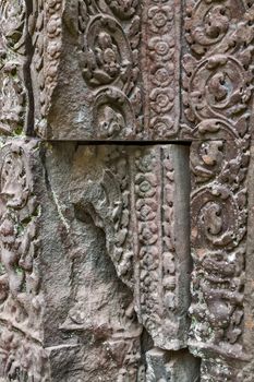 art of ancient Hindu god stone background, detail of the architecture in Bantey Srei temple in the Angkor area, Cambodia.