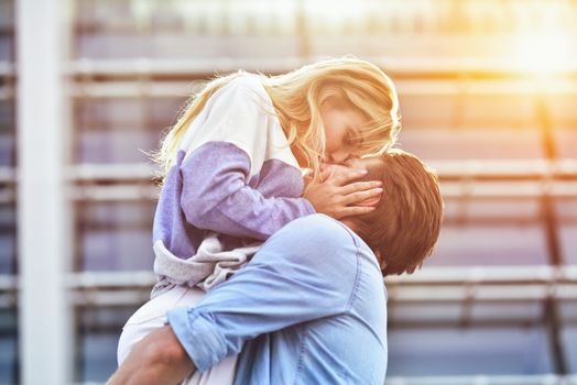 Happy to spending time together. Young beautiful couple outdoor fashion portrait.