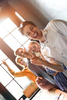 Close up photo of young business people stay together.