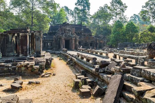 Ruins stone temple of Angkor Wat, part of Khmer temple complex, Asia. Siem Reap, Cambodia. Ancient Khmer architecture in jungle.