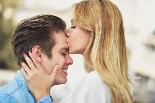 Happy to spending time together. Young beautiful couple outdoor fashion portrait.