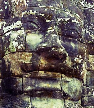 Ancient stone faces of king Bayon Temple Angkor Thom, Cambodia. monument Khmer architecture Kampuchea.
