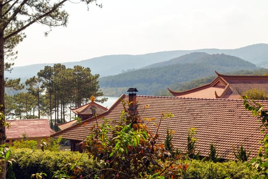 red roof temple, wooden monastery. Buddhist building landmark travel. Old Asia famous culture.