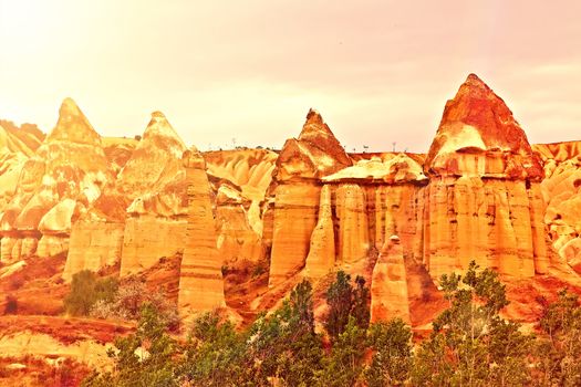 Love valley needles striped, Volcanic tuff named phallic rock pillar. Rocky landscape of Cappadocia in Turkey, Aerial photography.