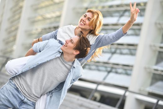 Beautiful couple in love dating outdoors and smiling.