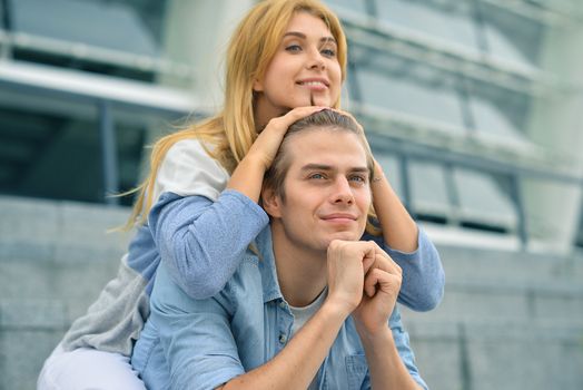 Beautiful couple in love dating outdoors and smiling.