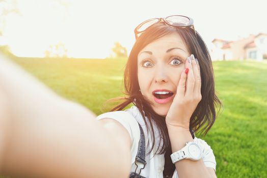 Fun Emotion, Adult woman having fun in nature, taking selfie. fun