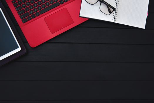 Home work concept, Tablet Pc, notepad and Laptop on wooden background, planning personal income. preparation to work. free copyspace