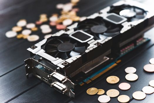 Cryptocurrency mining concept with bitcoins on a computer videocard. free copyspace