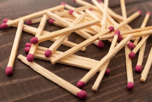 Matches on a white isolated background. Matches on a wooden background. Matches
