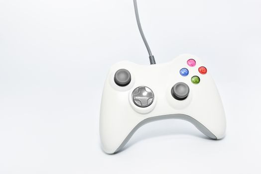 Gaming console game pad isolated on white background. Video gaming concept. Top view cut out composition.