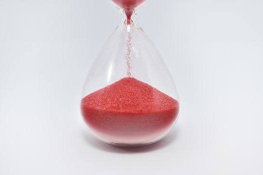 Hourglass clock isolated on white background