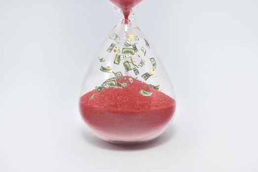 Hourglasses and coin isolated on white background. Time as money concept. money inside sandclock