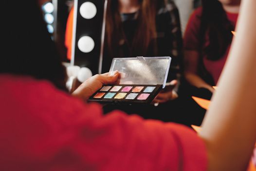 makeup. The process of applying makeup will begin. Colorful palette. Cosmetics for festive evening day makeup