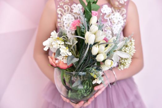 little girl with artificial flowers, close-up view