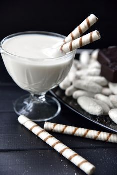 sweets, straws in the cream, cookies and candies on the table