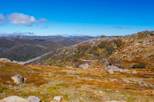 A spectacular view across the valley on the Kosciuszko walk near the summit of Thredo in Snowy Mountains, New South Wales, Australia