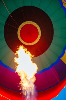 A blast of gas ignites, filling a hot air balloon with warm air on a cold winter's morning in Yarra Valley, Victoria, Australia