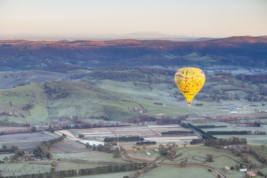 A sunrise hot air balloon flight over the Yarra Valley in Victoria, Australia