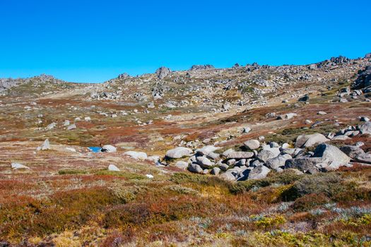 A spectacular view across the valley on the Kosciuszko walk near the summit of Thredo in Snowy Mountains, New South Wales, Australia