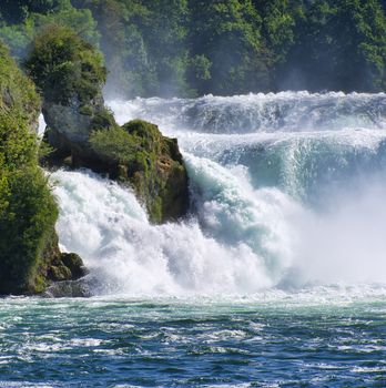 the famous rhine falls in the swiss near the city of Schaffhausen - sunny day and blue sky